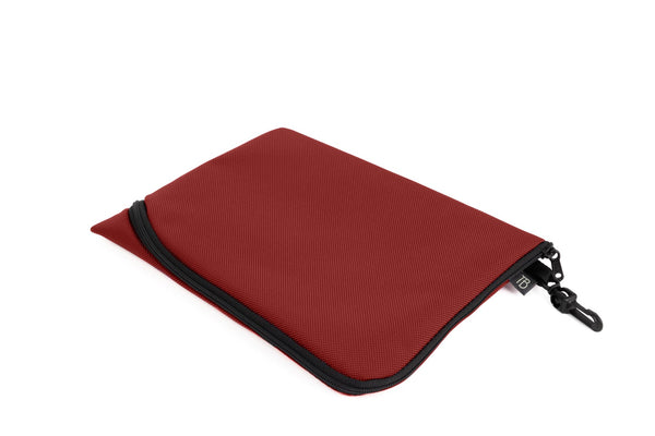 An A5 Ghost Whale Pouch in Mars Red (brick red).